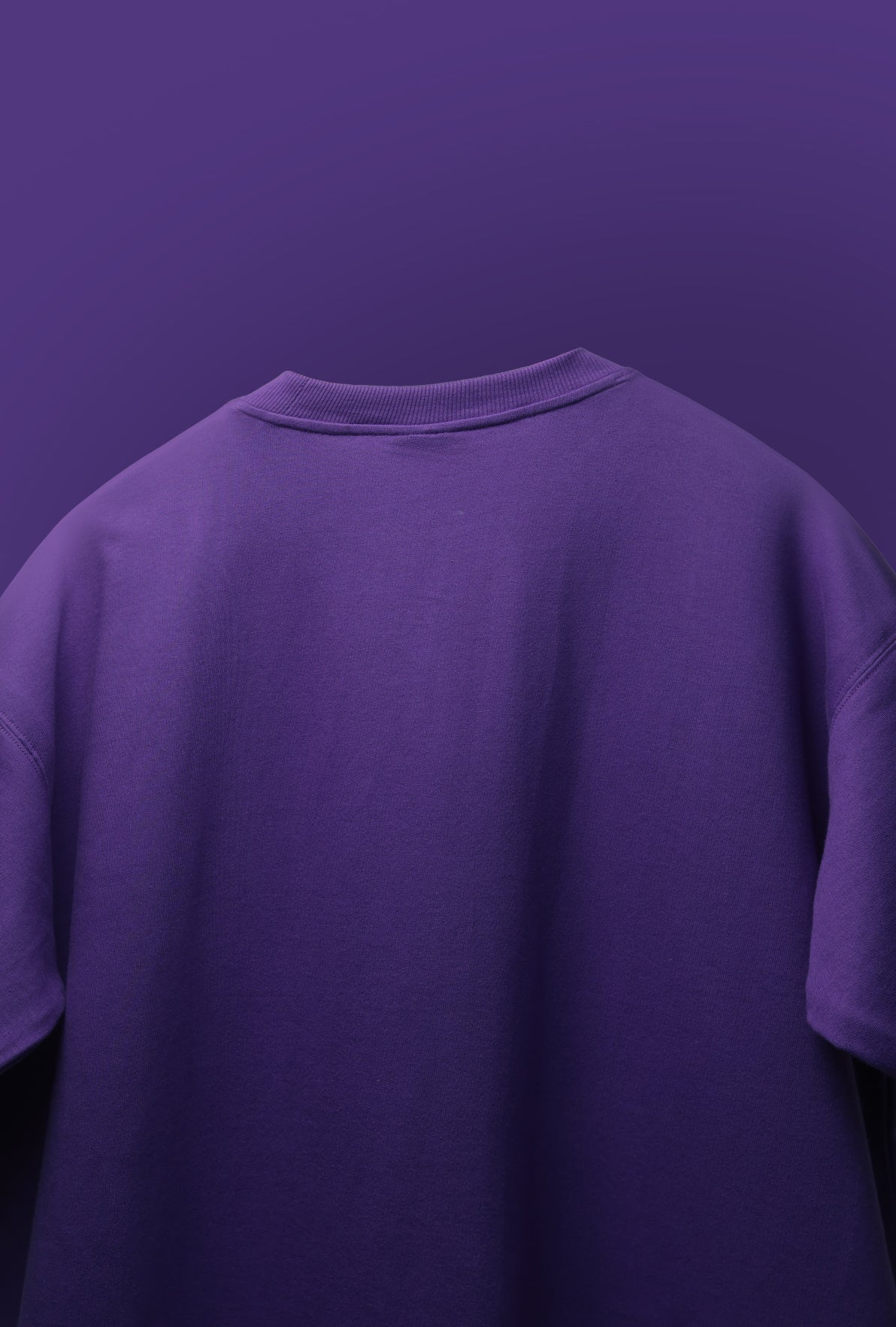 Purple t-shirt on a matching purple background - Crepdog Crew