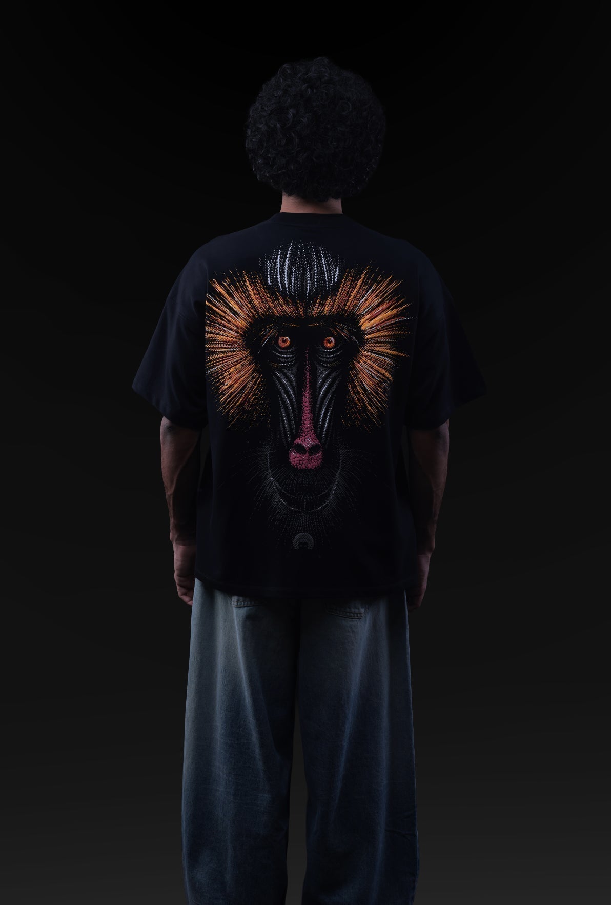 Person wearing a black t-shirt with a graphic design on the back against a dark background Crepdog Crew