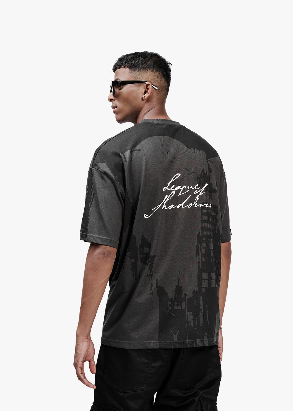 Man wearing a black t-shirt with 'Legends Never Die' text on the back, on a white background - Crepdog Crew