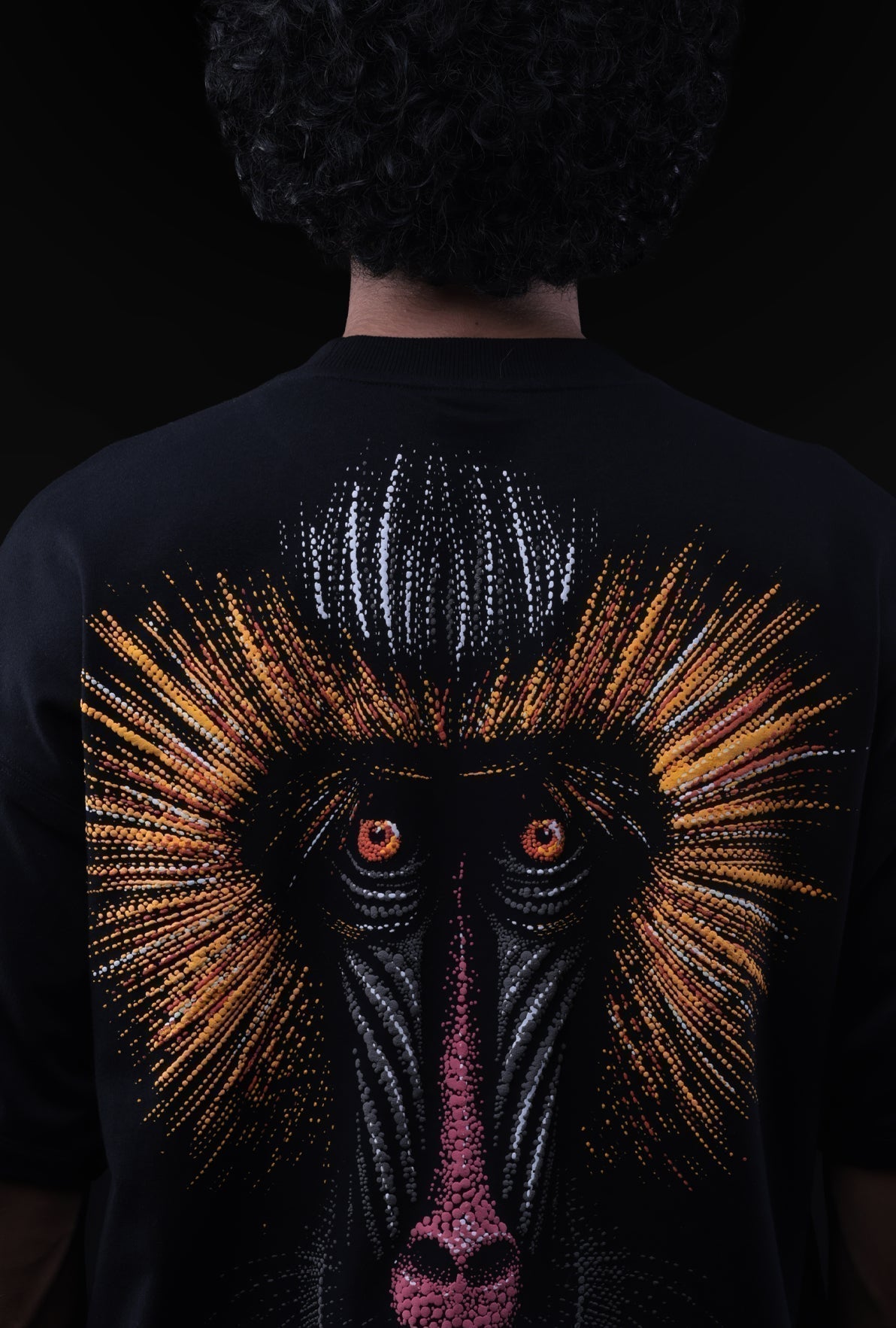 Person wearing a black shirt with a detailed monkey design on the back against a dark background Crepdog Crew