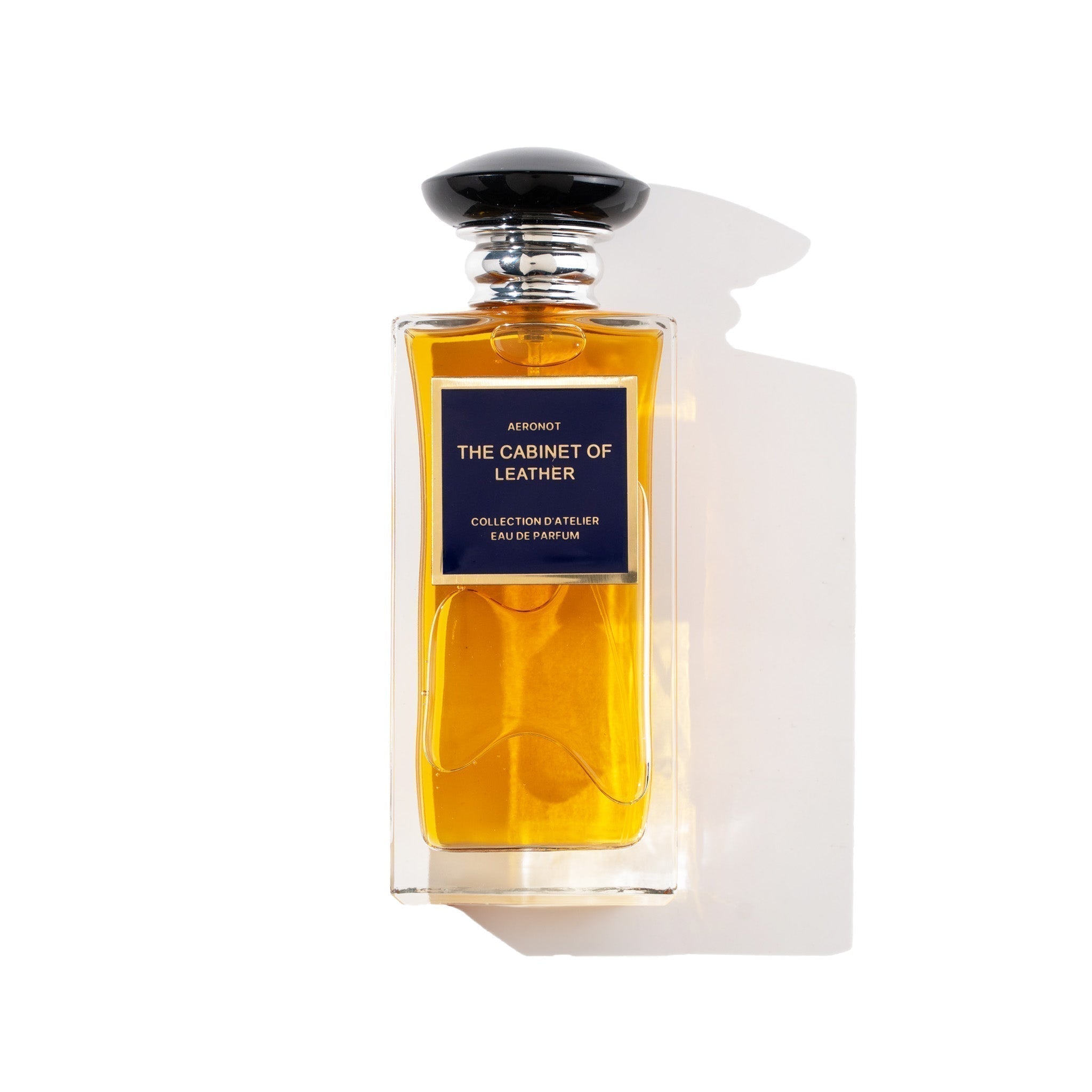 Perfume bottle labeled 'The Cabinet of Leather' by Atelier Versace on a white background - Crepdog Crew