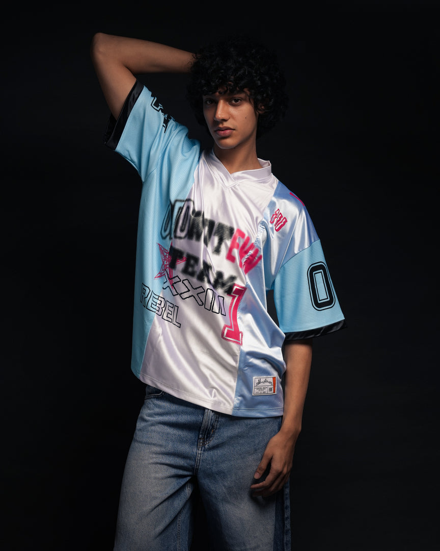 Person wearing a colorful baseball jersey with text on a black background - Crepdog Crew