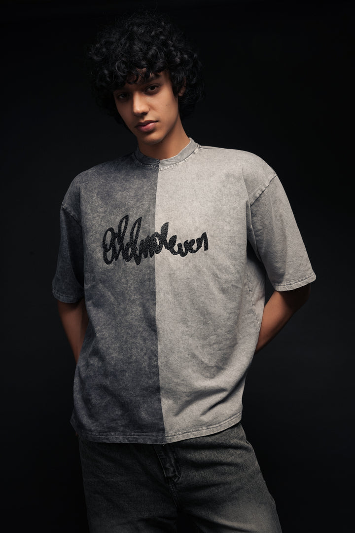 Person wearing a gray t-shirt with 'Old Navy' logo on a black background - Crepdog Crew