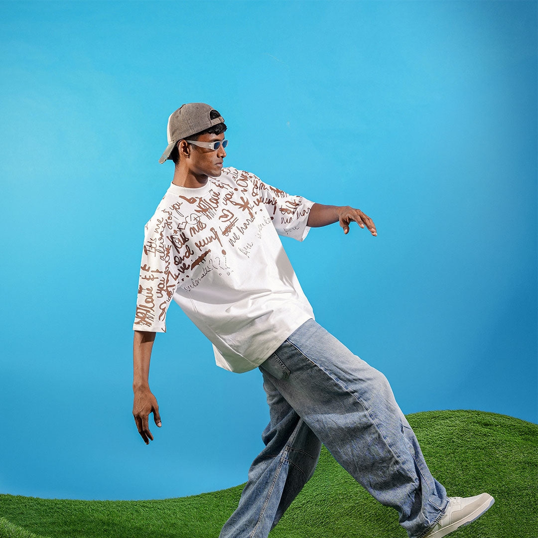 Person in casual outfit with white shirt and gray pants against a blue sky Crepdog Crew