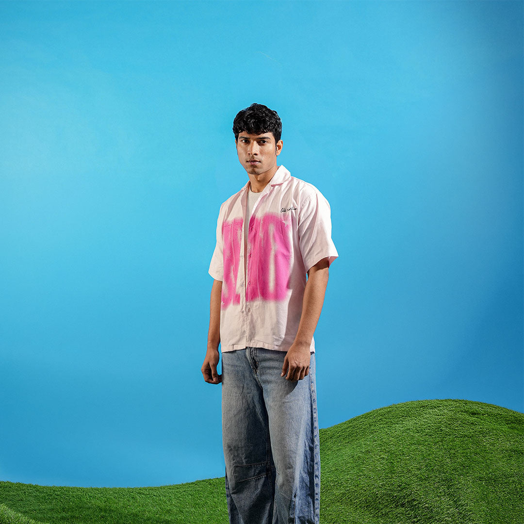 Person wearing a light-colored shirt with pink text on a blue background Crepdog Crew