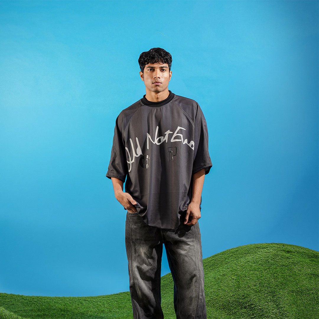 Person wearing a black t-shirt with text on a blue background Crepdog Crew