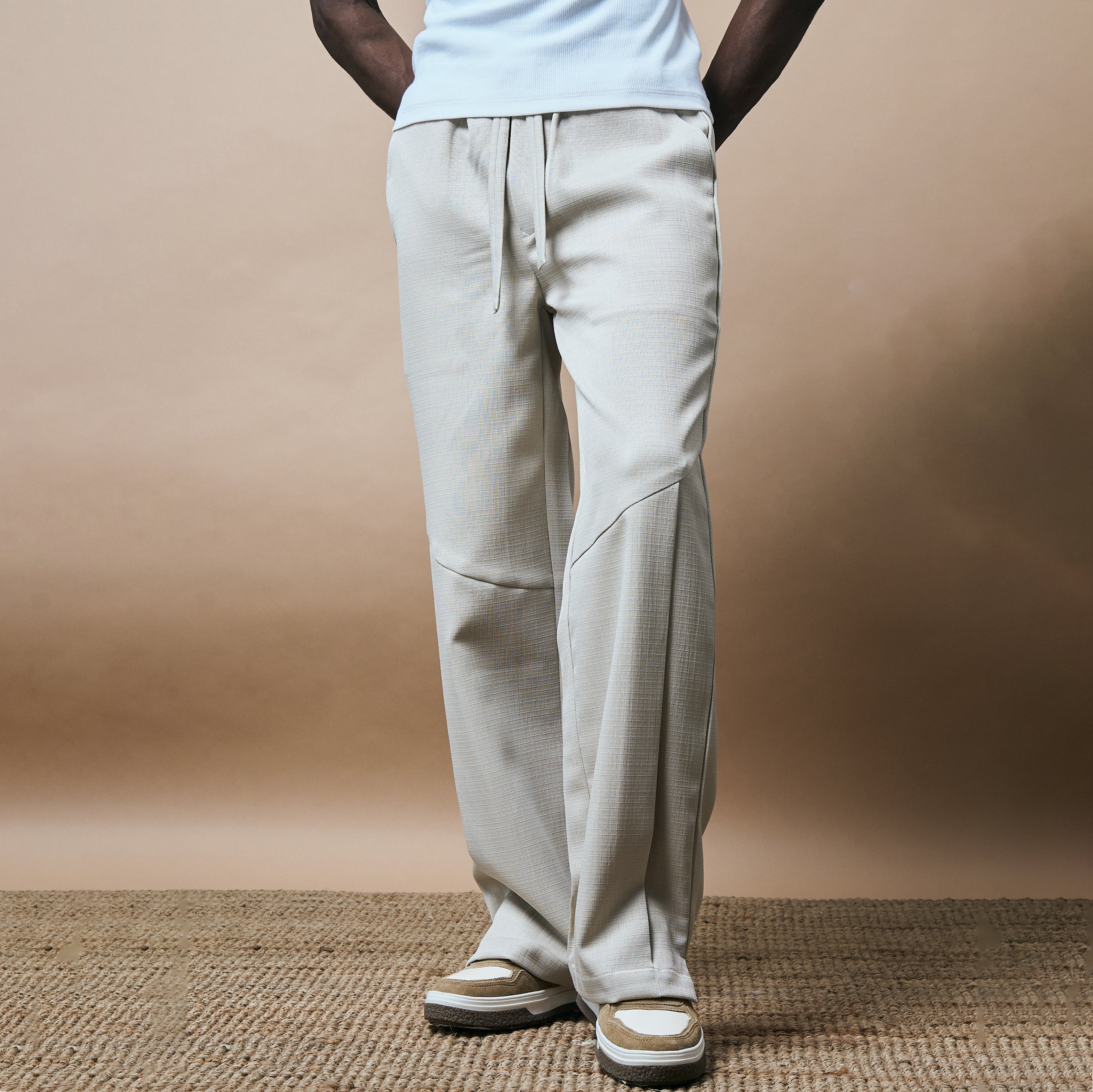 PLEATED ARCH CUT PANTS- BISCUIT