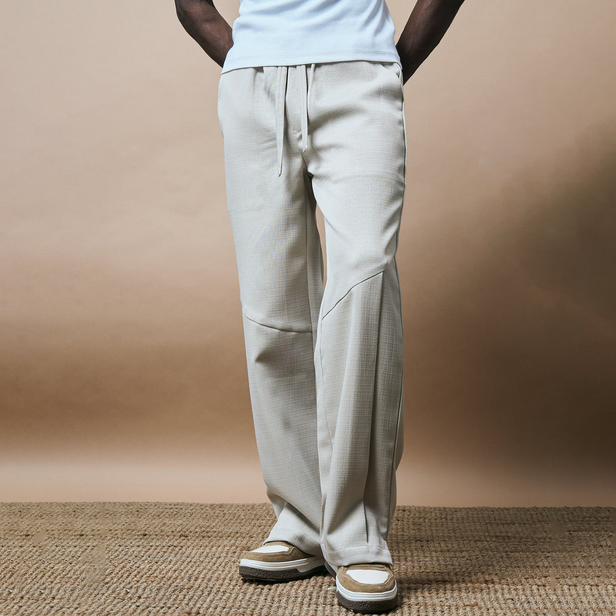 PLEATED ARCH CUT PANTS- BISCUIT