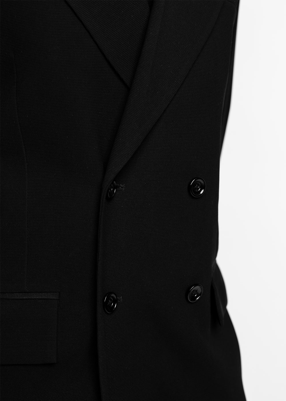Close-up of a black double-breasted suit jacket with buttons on a white background - Crepdog Crew