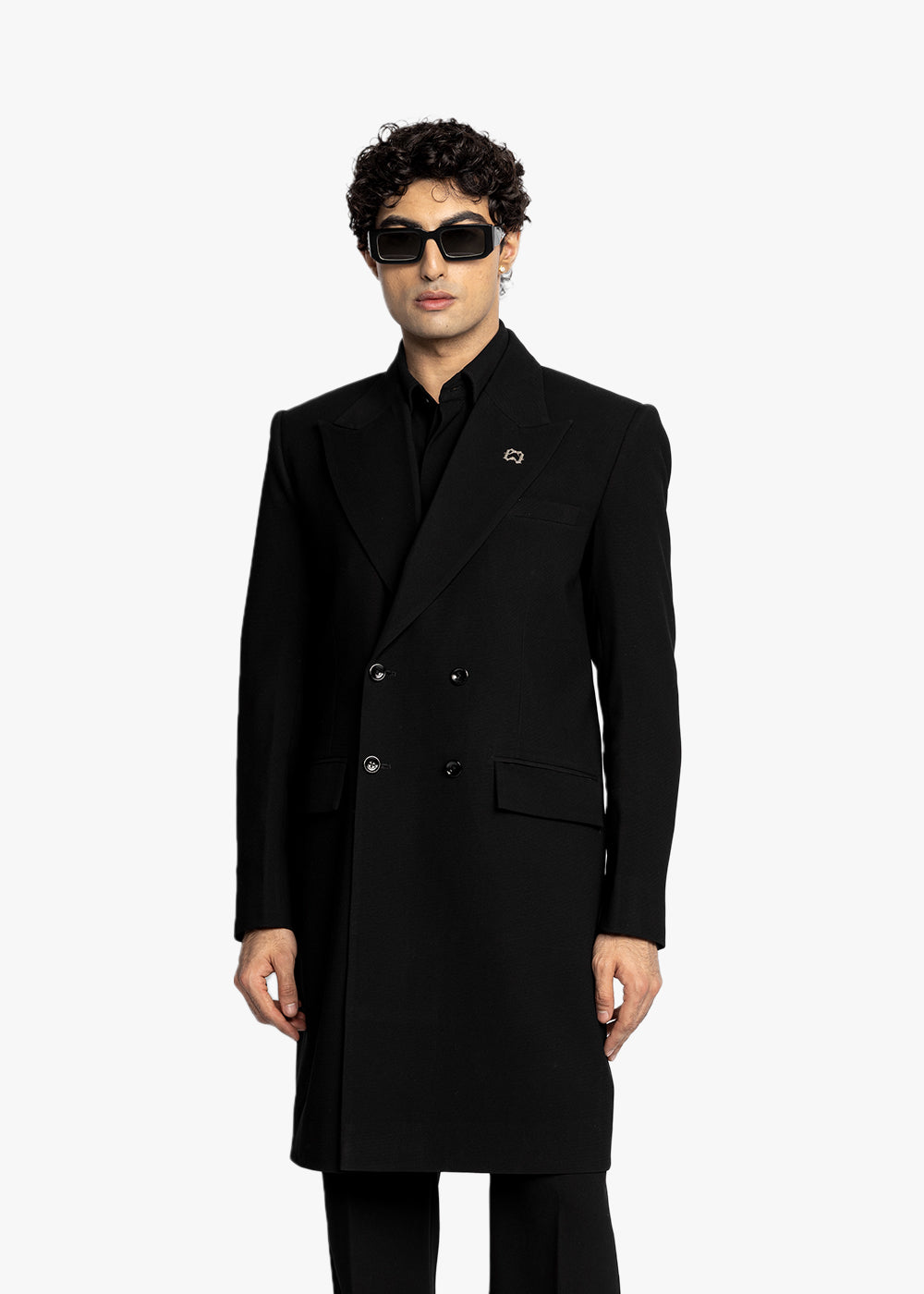 Man wearing a black coat with a brand logo on a white background - Crepdog Crew