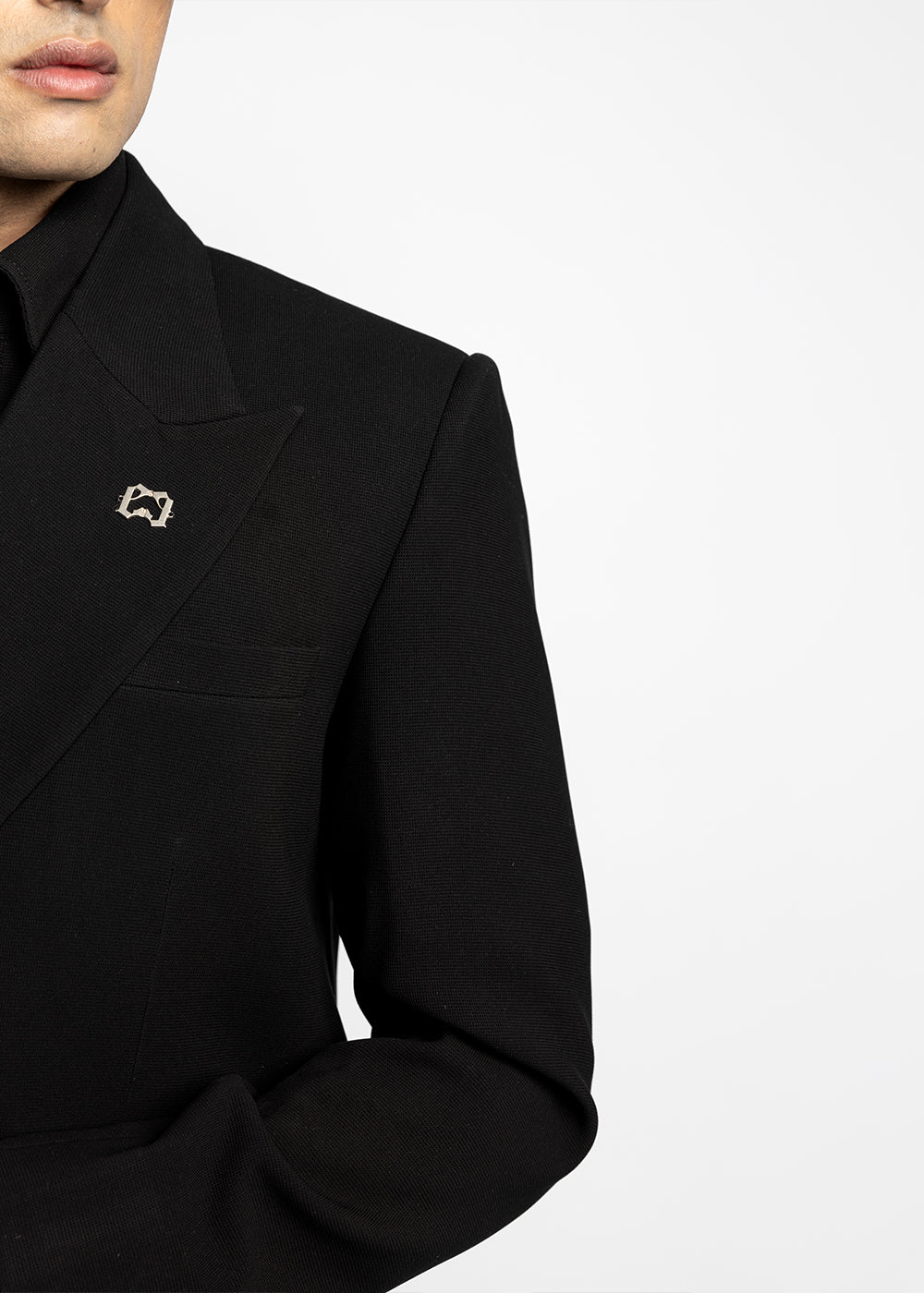 Black coat with a small decorative element on a white background - Crepdog Crew