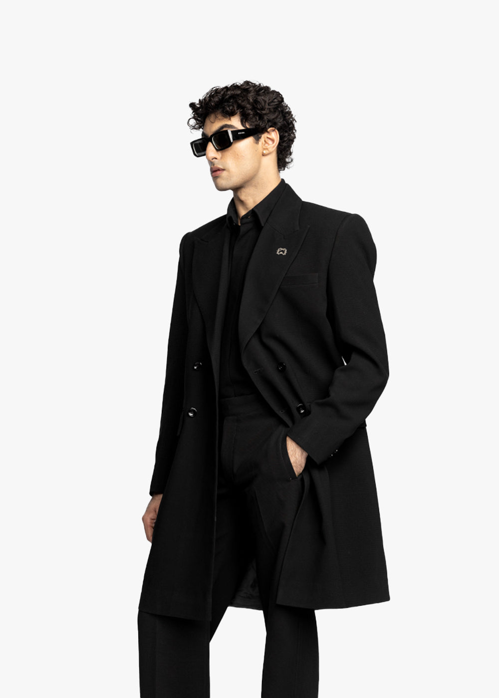 Man wearing a black coat and sunglasses on a white background - Crepdog Crew