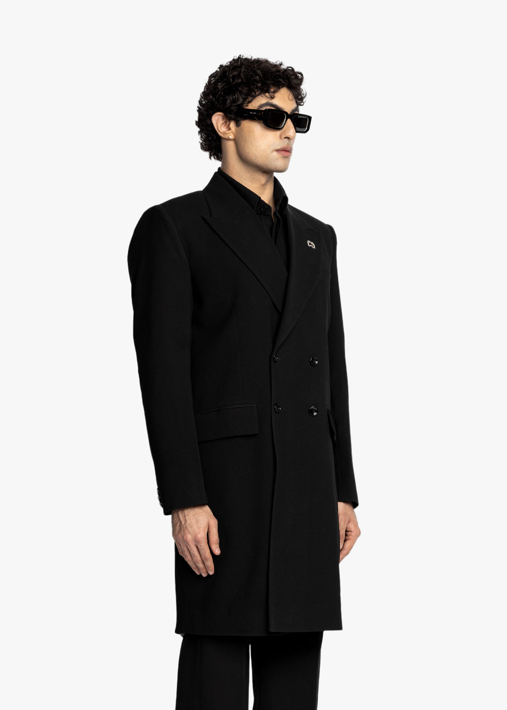 Man wearing a black coat and sunglasses on a white background - Crepdog Crew