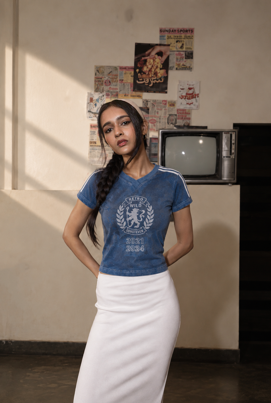 Model wearing the Blue Lions Retro Baby Tee, front view