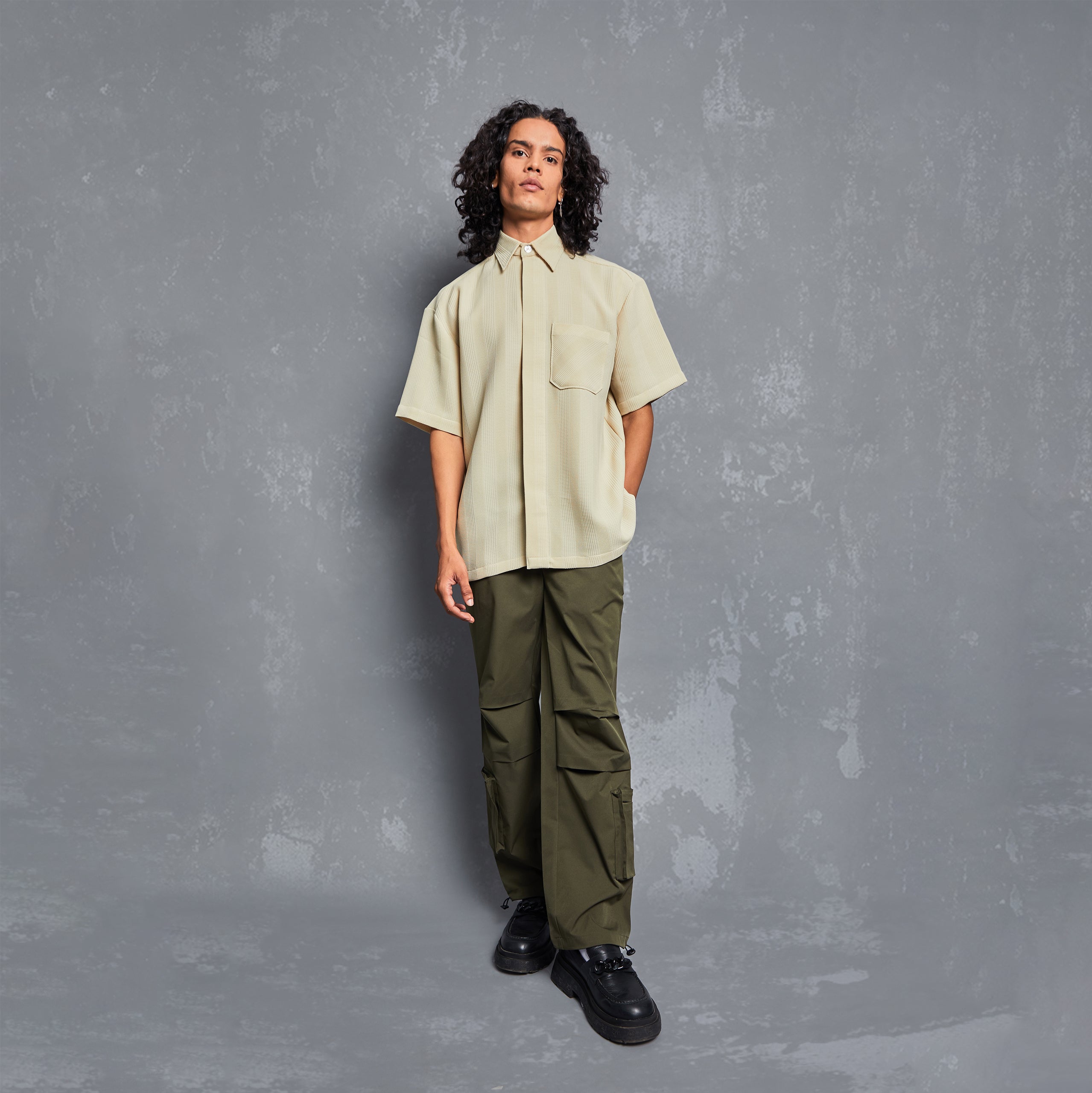 editorial, lookbook, 100% polyester fabric, textured polyester fabric, lightweight polyester fabric, inega, inega india, warping theories, unisex, warping theories india, summer outfit inspiration, cargos, moderate olive cargos, olive cargo pants, shirts withj pants, mens shirts styled with cargo pants, people also ask