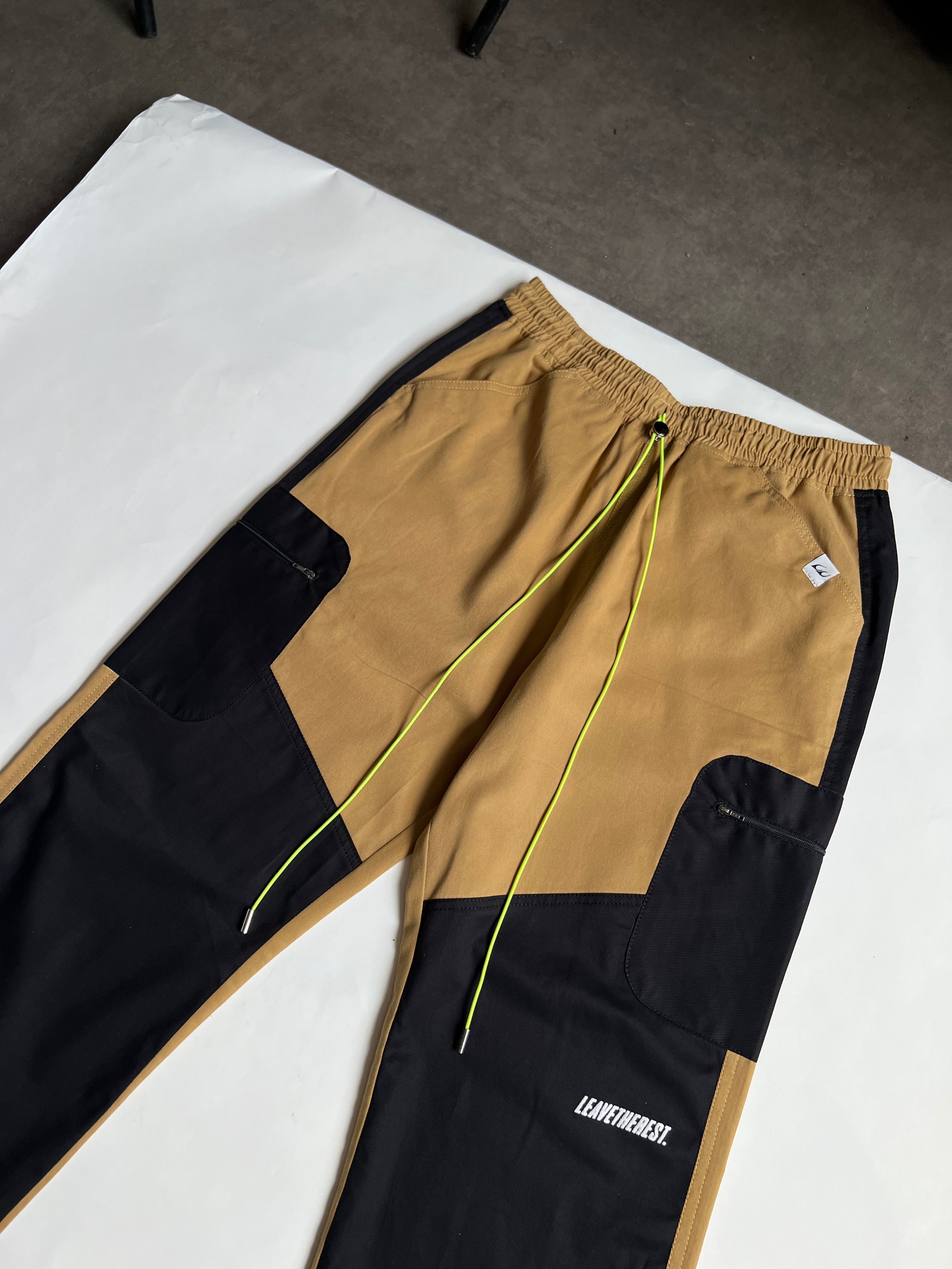 Utility panelled desert-black pant.
