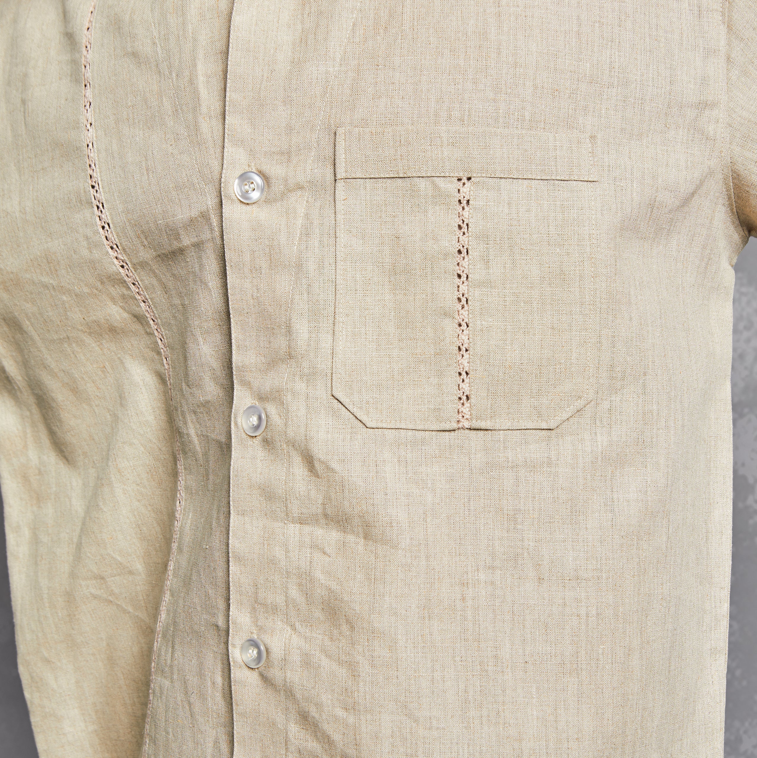 close up, shirt, details, breathable lightweight fabric, cuban collar, laced up detail on pocket, tailored fit, pocket utility, chic look, formal tailored, people also ask