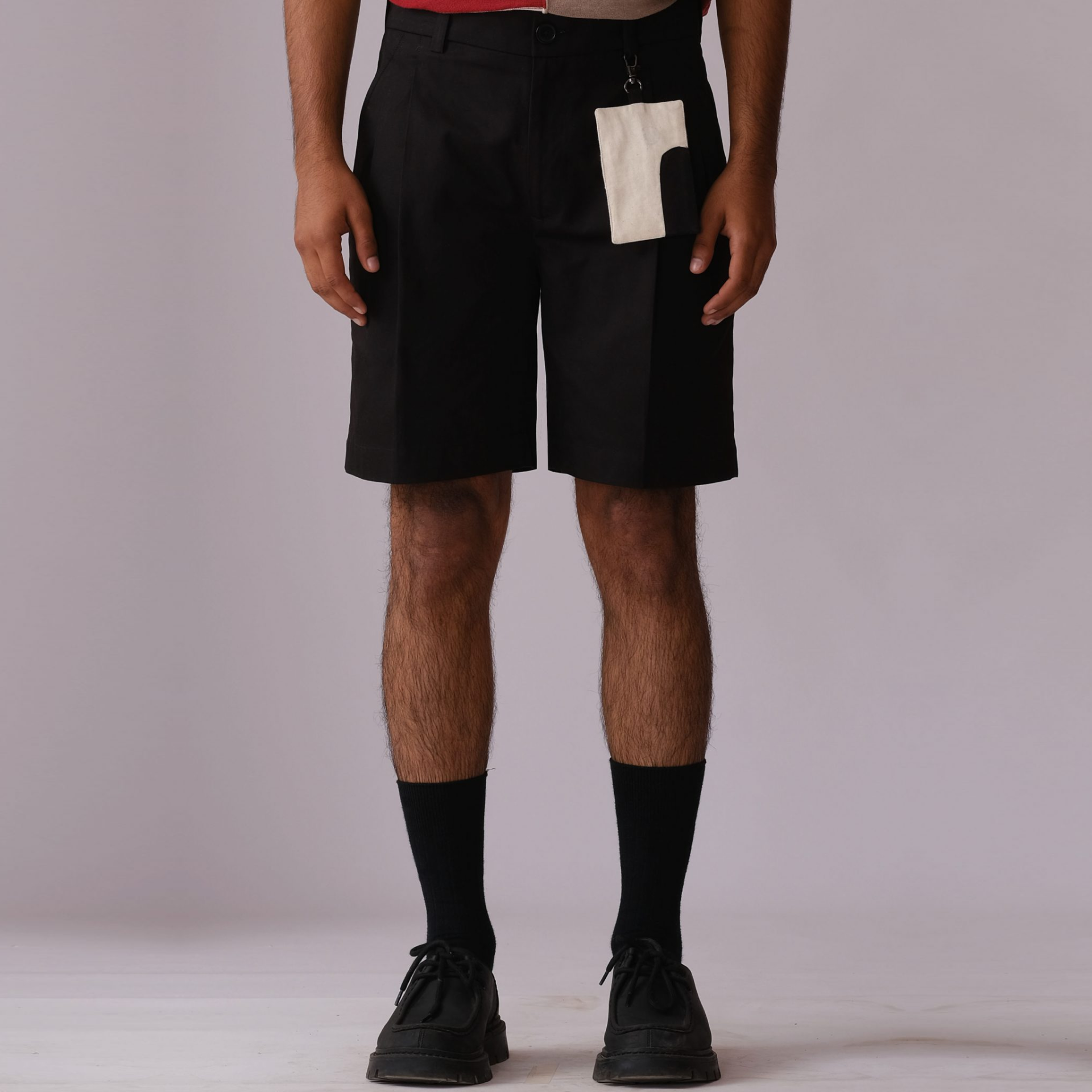 Pleated Shorts with Detachable Human Symbol