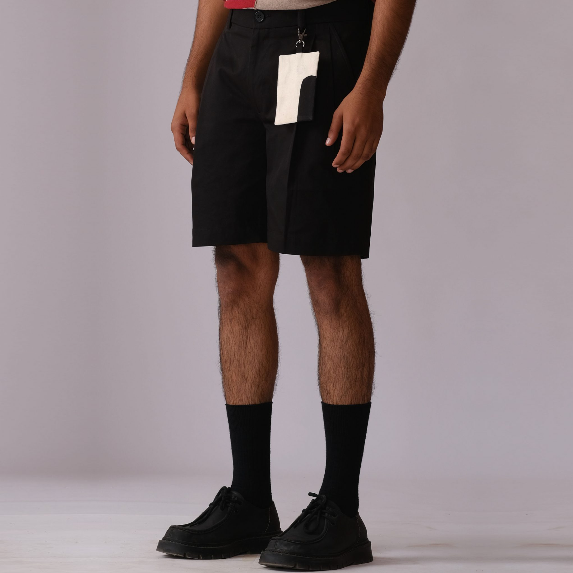 Pleated Shorts with Detachable Human Symbol