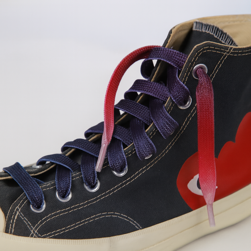 Close up of a sneaker with  Red - Purple - Light Pink Gradient shoelaces on the shoe