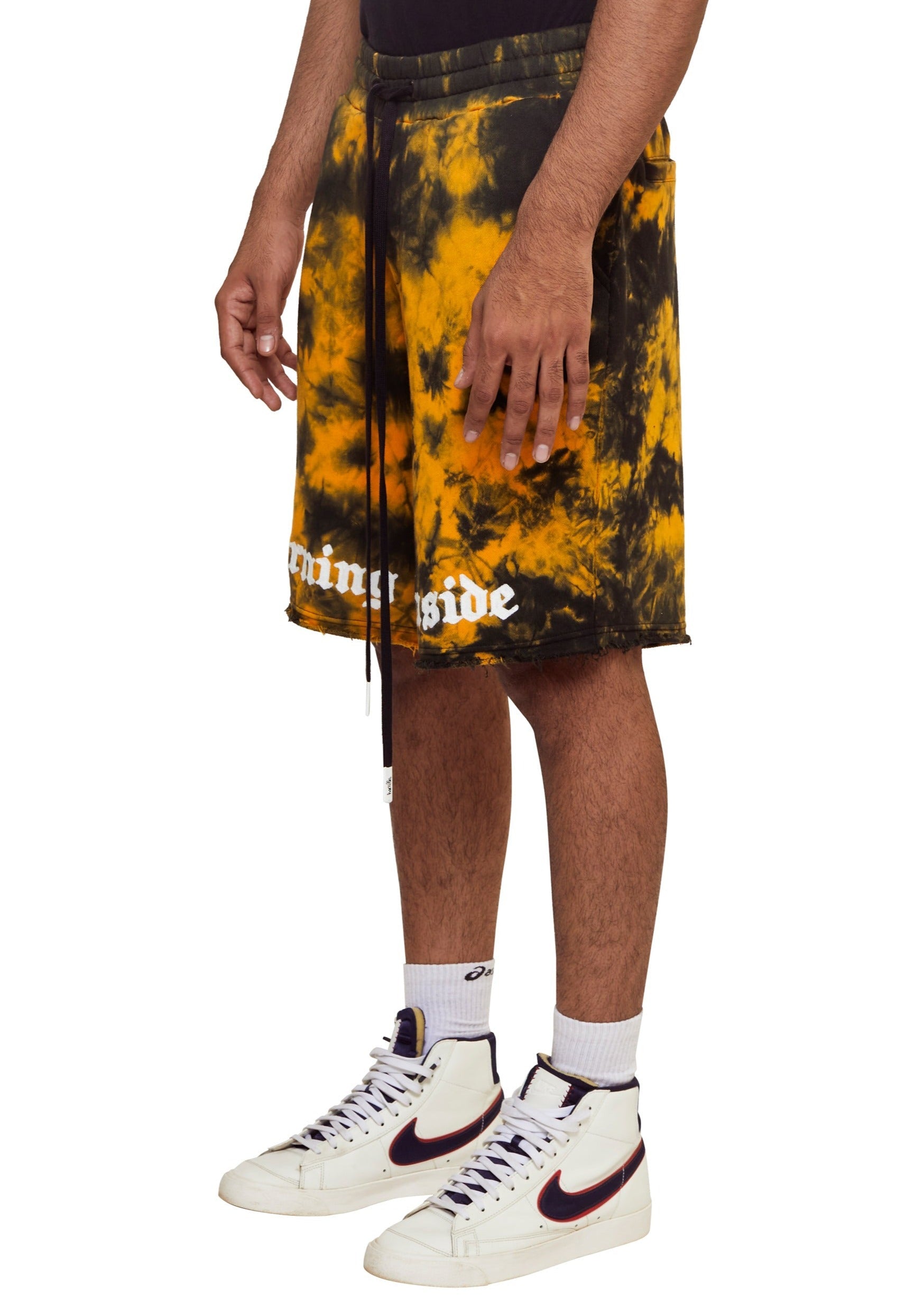 Yellow Fire tie-dye knit shorts with chenille embroidery "Burning Inside" above the hem from the brand Haculla