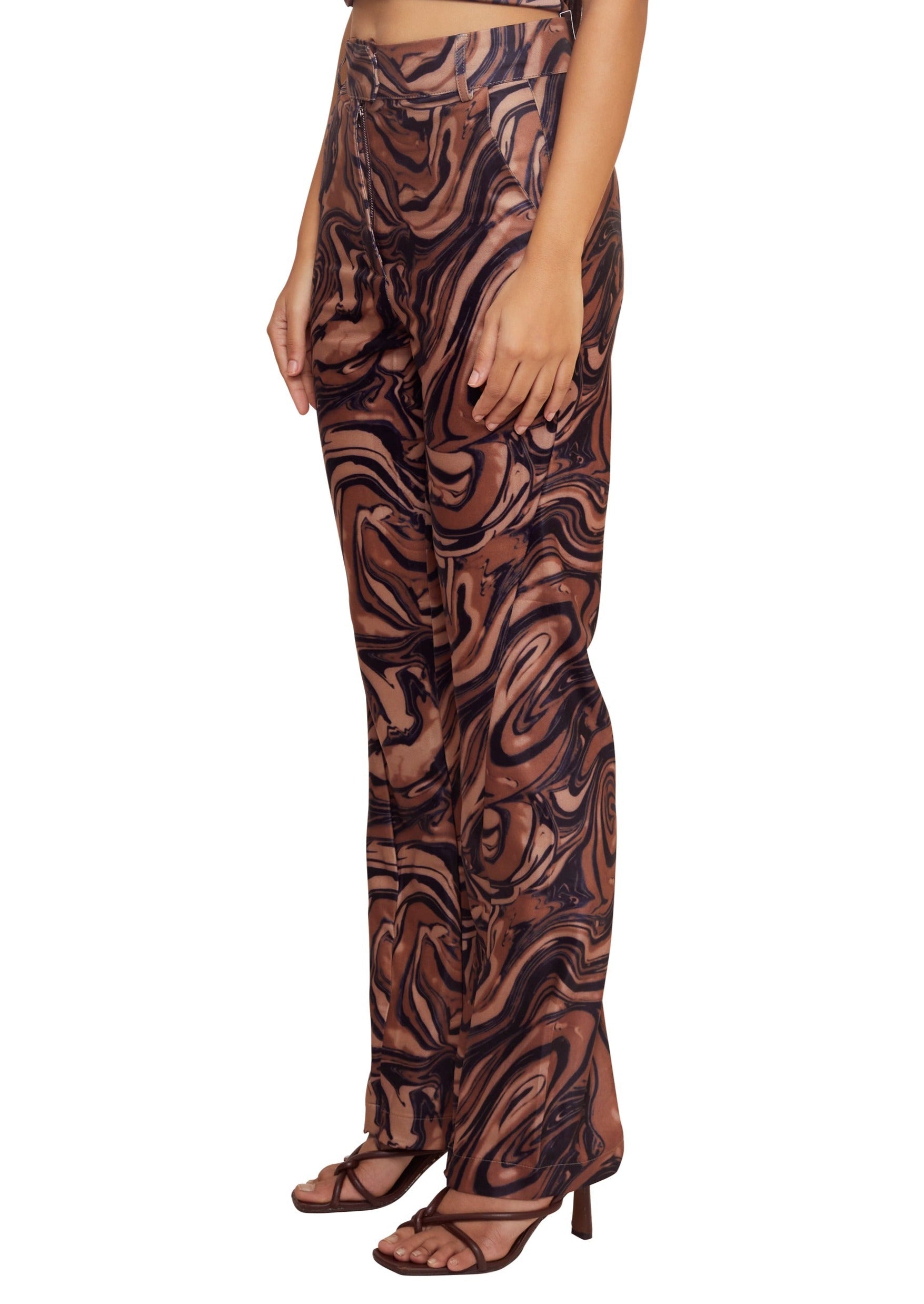 Brown stretchy high waisted flared trousers with an abstract print from House of sunny