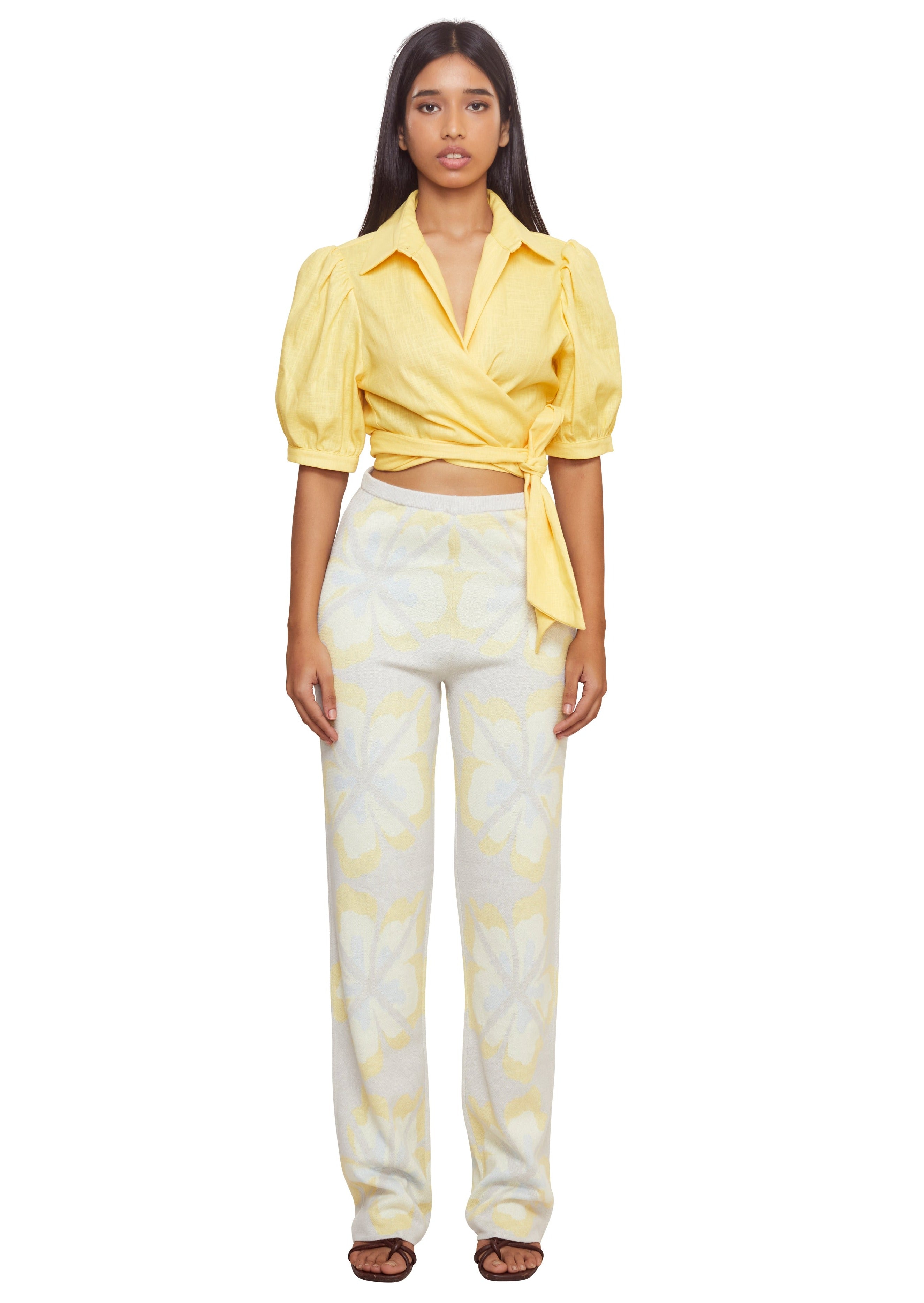 Mix up your classic shirt by making it yellow, linen and tied at the waist with low shoulders and mid-length puffy sleeves from the brand Musier
