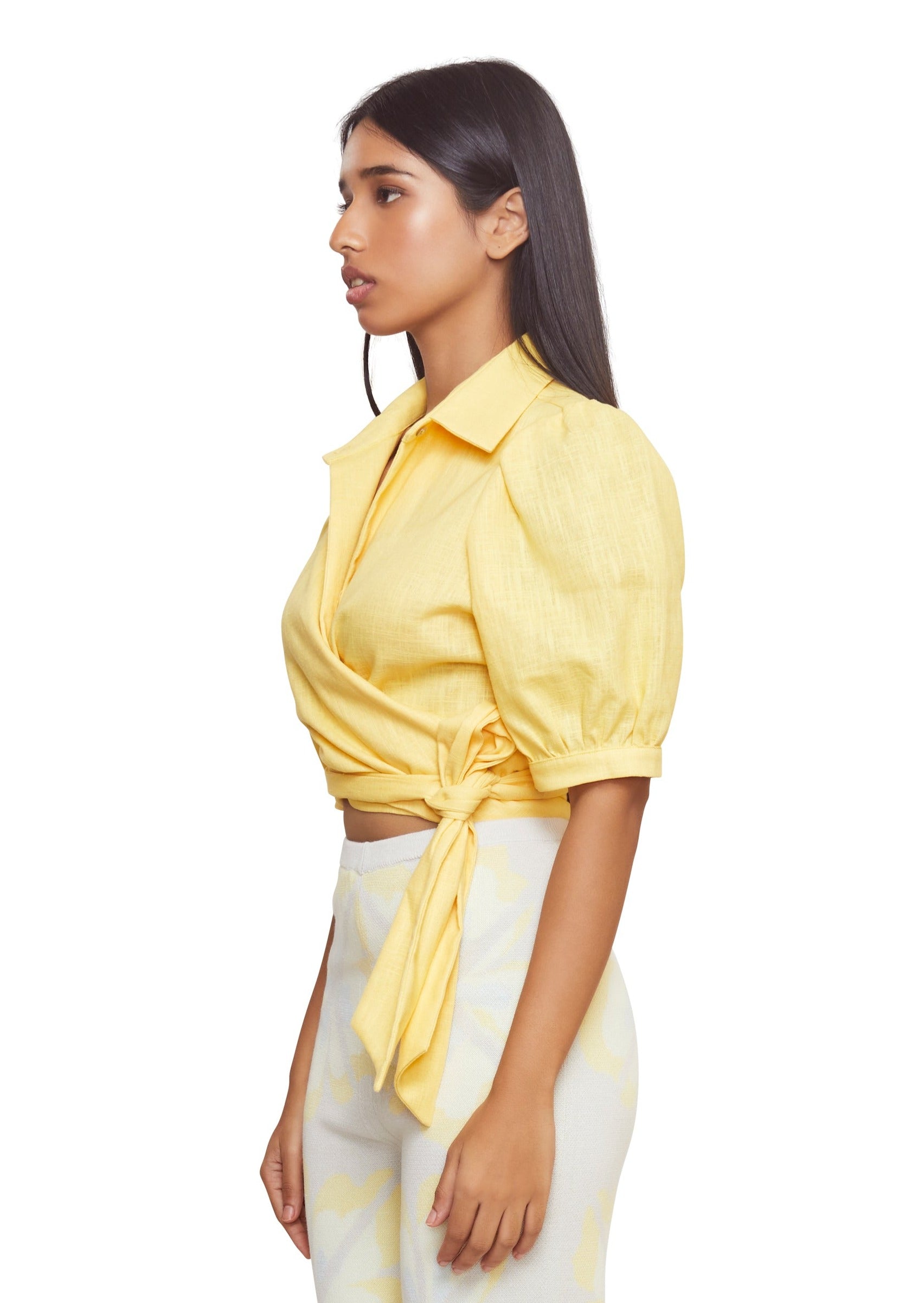 Mix up your classic shirt by making it yellow, linen and tied at the waist with low shoulders and mid-length puffy sleeves from the brand Musier